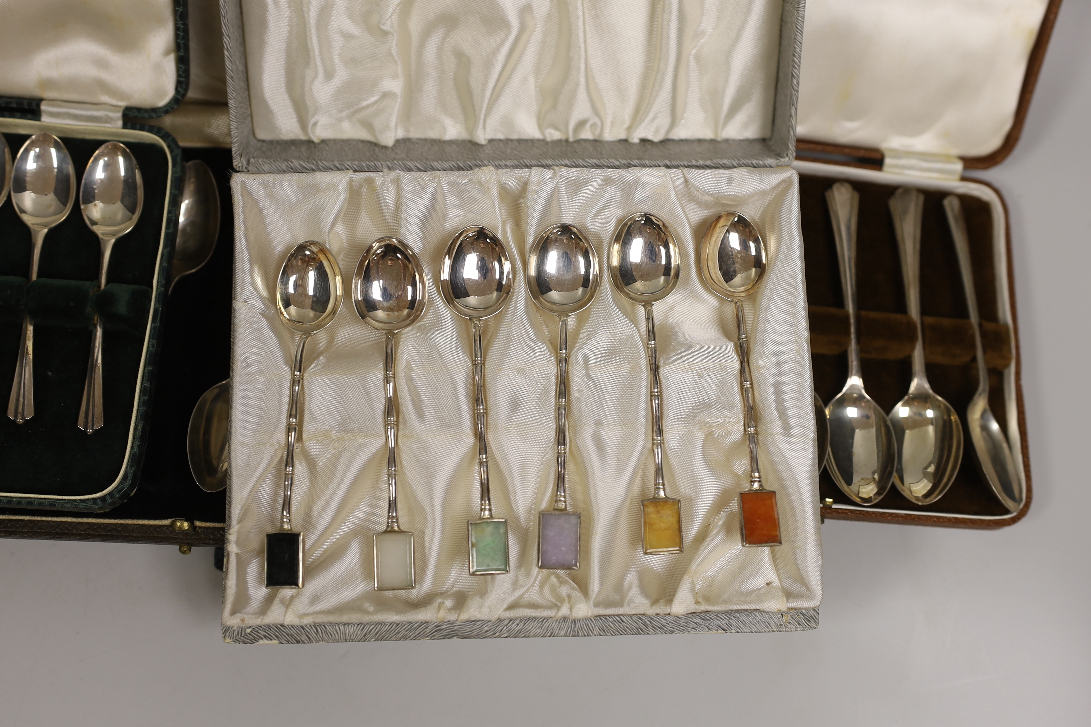 Seven various cased part sets of silver cutlery to include teaspoons etc., together with a cased set of six sterling silver faux bamboo coffee spoons with semi-precious stone tablet inset terminals.